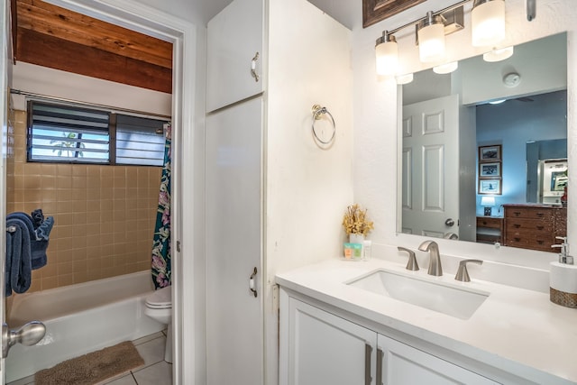 full bathroom featuring vanity, tile patterned floors, toilet, and shower / tub combo with curtain