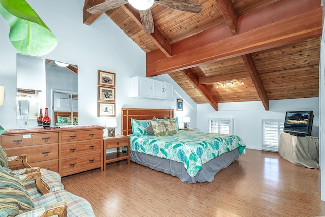 bedroom with wooden ceiling, beam ceiling, light hardwood / wood-style flooring, and high vaulted ceiling