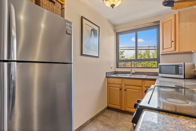 kitchen featuring stainless steel appliances and sink