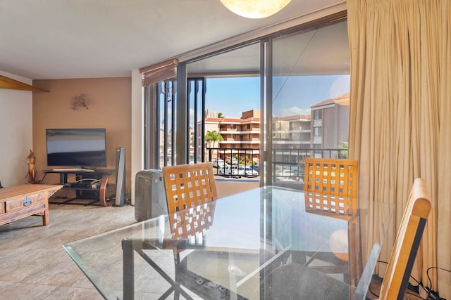 dining area with a wall of windows