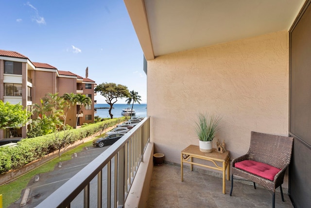 balcony featuring a water view