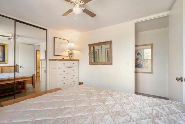 unfurnished bedroom with ceiling fan and a closet