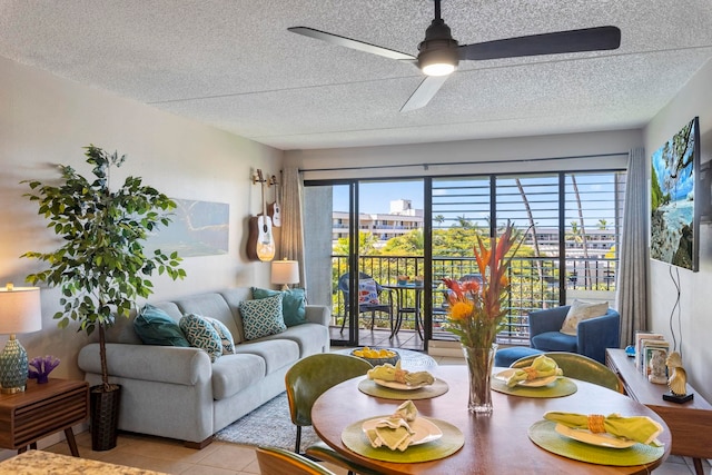 living room with light tile patterned floors, a wealth of natural light, a textured ceiling, and ceiling fan