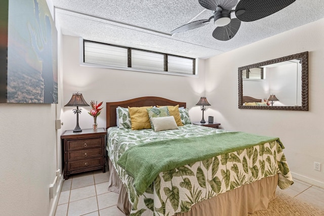 tiled bedroom with ceiling fan and a textured ceiling