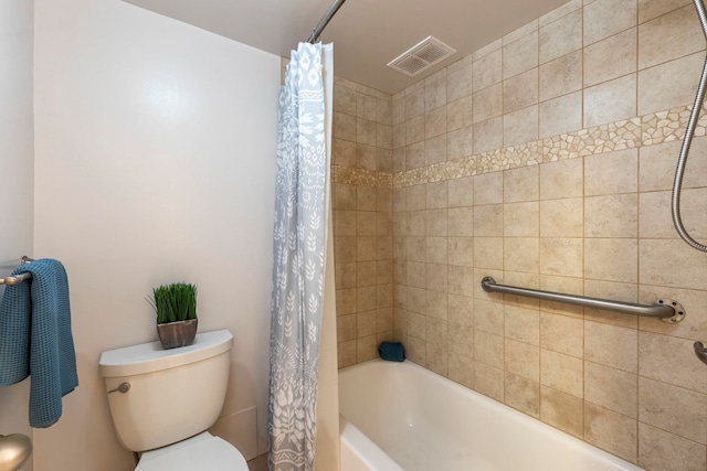 bathroom with toilet and shower / bath combo with shower curtain