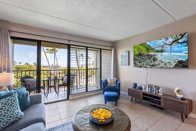 tiled living room featuring a textured ceiling