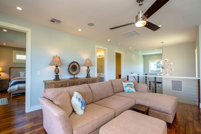 living room featuring visible vents and dark wood-type flooring