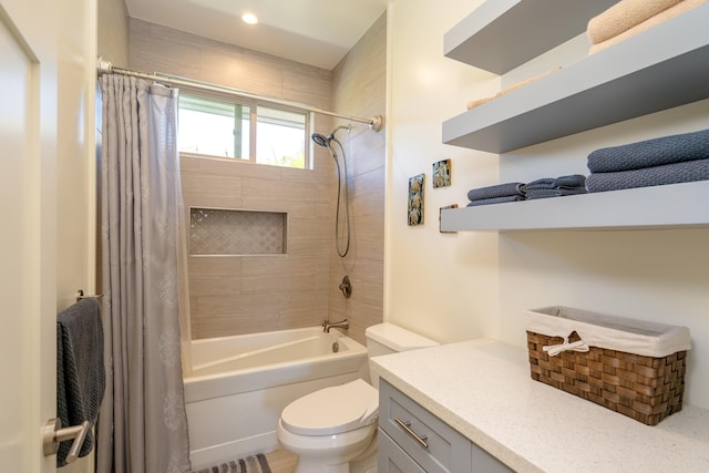 full bath with shower / bathtub combination with curtain, toilet, and vanity