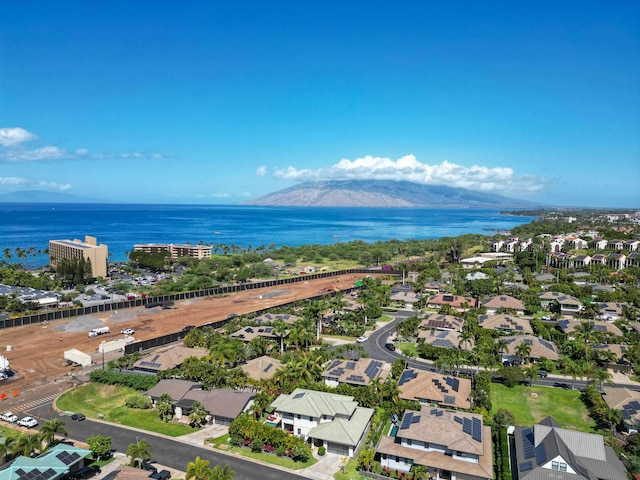 birds eye view of property featuring a water and mountain view