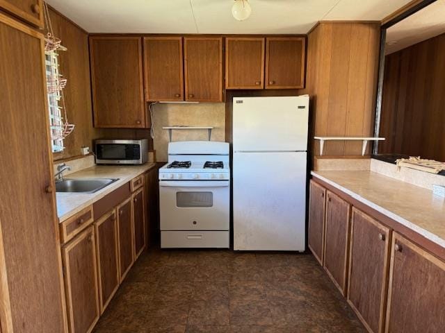 kitchen with sink and white appliances