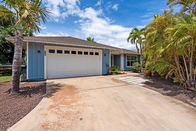 237 Kuli Puu St, Kihei, HI 96753 - ranch-style house featuring an attached garage, concrete driveway, and board and batten siding