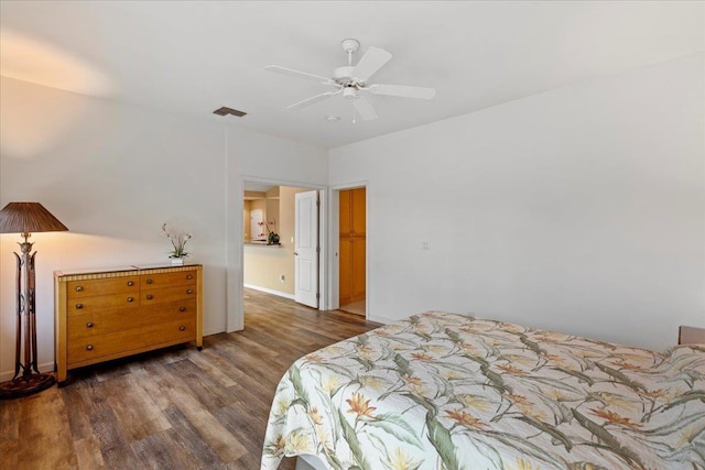 237 Kuli Puu St, Kihei, HI 96753 - bedroom with wood finished floors, a ceiling fan, and baseboards