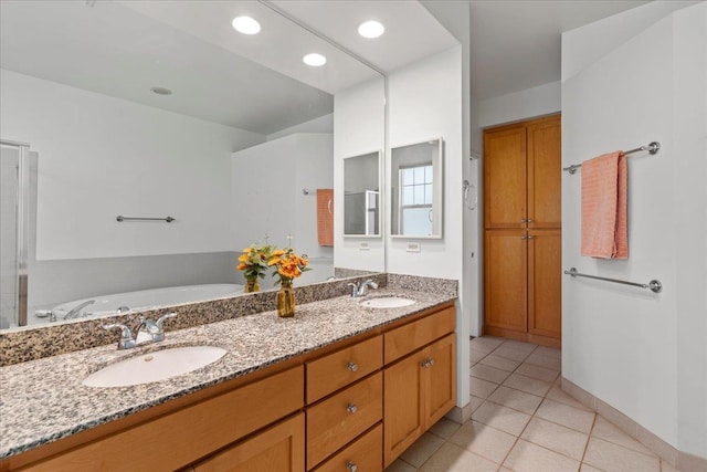 237 Kuli Puu St, Kihei, HI 96753 - bathroom with tile patterned flooring, double vanity, and a tub