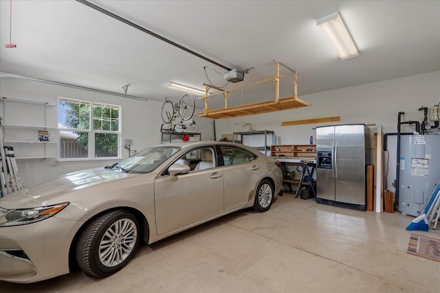 237 Kuli Puu St, Kihei, HI 96753 - garage featuring stainless steel fridge, a garage door opener, and electric water heater