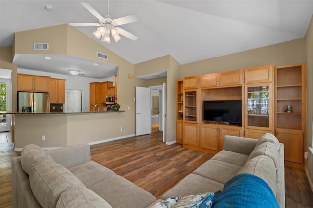 237 Kuli Puu St, Kihei, HI 96753 - living room featuring dark wood-type flooring, high vaulted ceiling, a ceiling fan, and baseboards