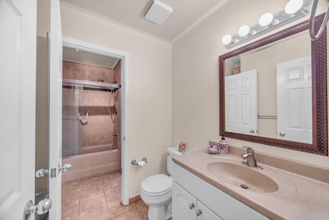 bathroom with vanity, tile patterned floors, toilet, shower / bath combination with glass door, and ornamental molding