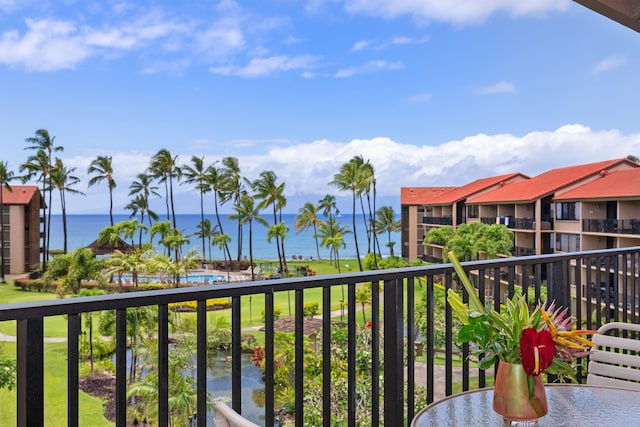 balcony featuring a water view