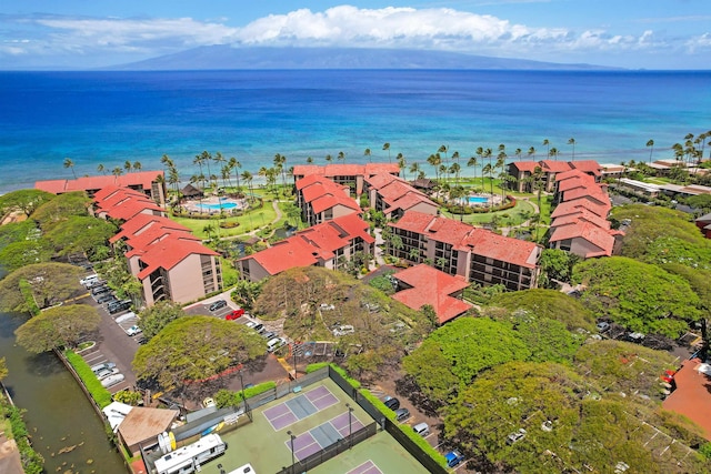 birds eye view of property with a water view