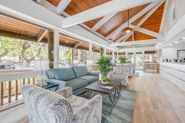 wooden deck featuring an outdoor living space and ceiling fan