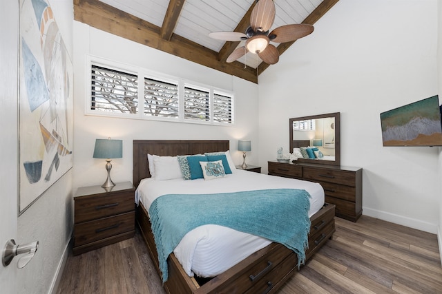 bedroom with ceiling fan, beam ceiling, and dark hardwood / wood-style flooring