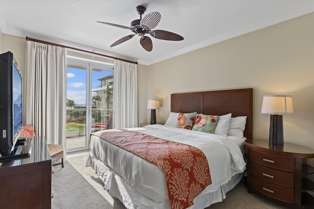 carpeted bedroom featuring a ceiling fan, crown molding, access to exterior, and a textured ceiling