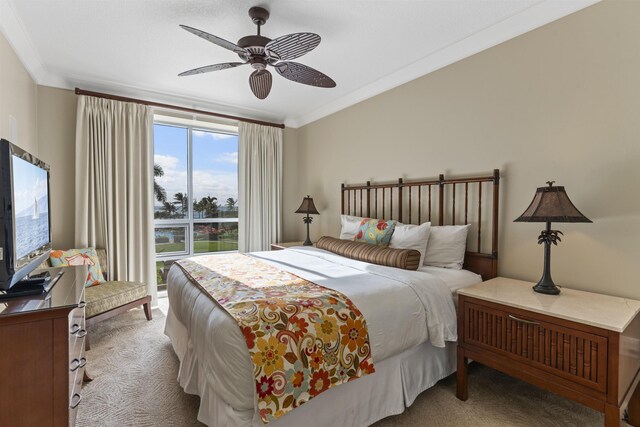 bedroom featuring ceiling fan, light colored carpet, and ornamental molding