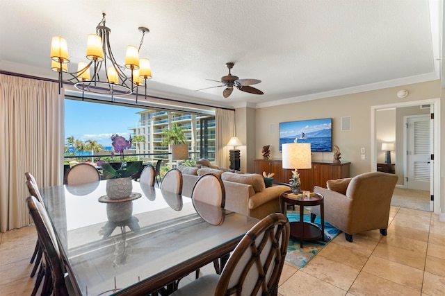 dining space featuring ornamental molding, ceiling fan with notable chandelier, and light tile patterned flooring