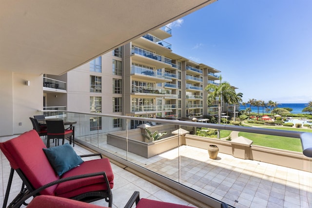 balcony featuring a water view