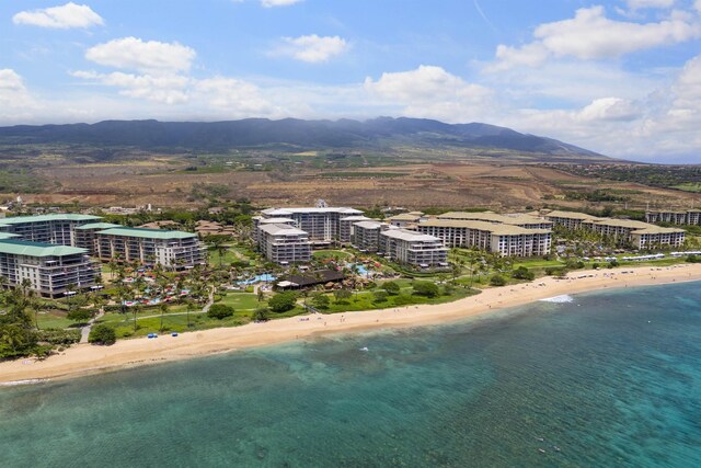 aerial view featuring a beach view and a water and mountain view