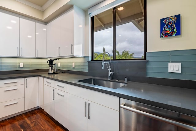 806 Kukia Pl, Kula, HI 96790 - kitchen with stainless steel dishwasher, crown molding, dark countertops, white cabinets, and tasteful backsplash
