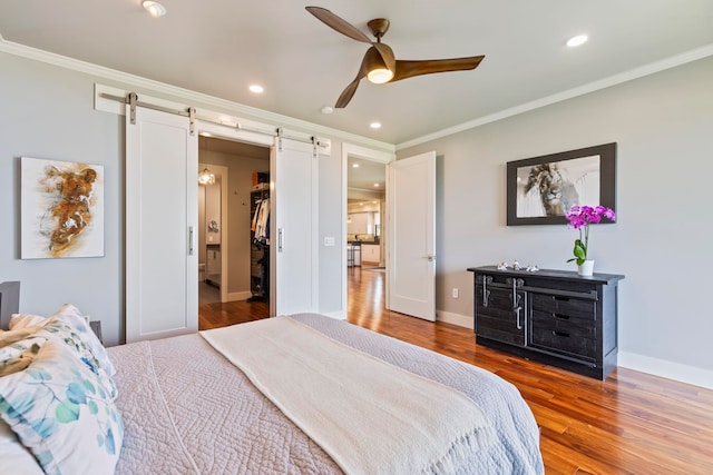 806 Kukia Pl, Kula, HI 96790 - bedroom with a barn door, crown molding, wood finished floors, recessed lighting, and a ceiling fan