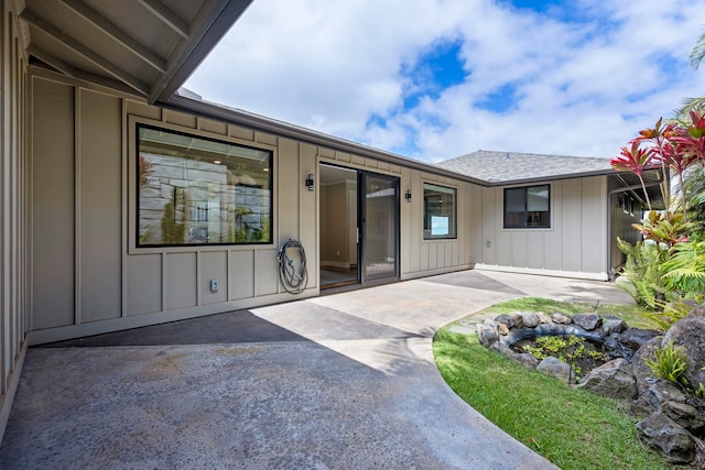 806 Kukia Pl, Kula, HI 96790 - entrance to property with board and batten siding, a patio area, and roof with shingles