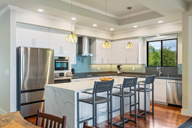 806 Kukia Pl, Kula, HI 96790 - kitchen featuring appliances with stainless steel finishes, wall chimney range hood, dark wood-style floors, white cabinetry, and recessed lighting