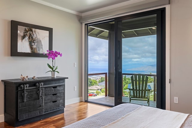 806 Kukia Pl, Kula, HI 96790 - bedroom with wood finished floors, access to exterior, and crown molding