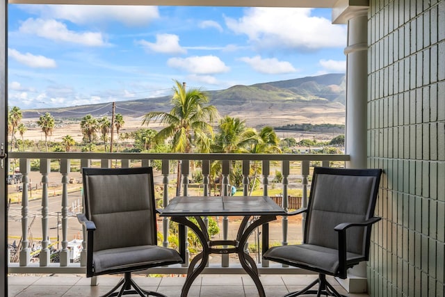 balcony featuring a mountain view