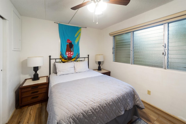 bedroom featuring ceiling fan and wood-type flooring