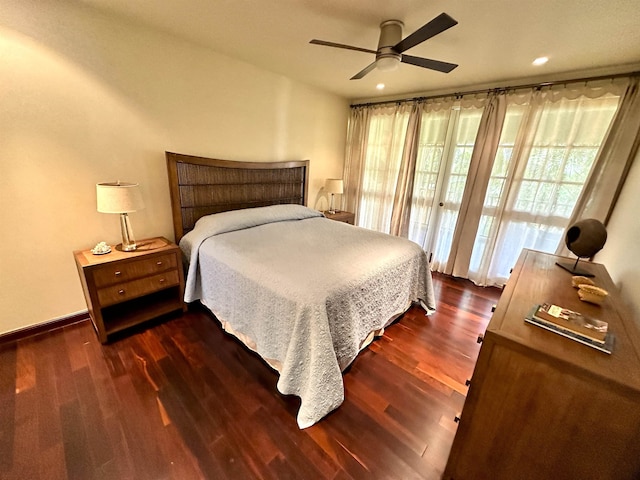 bedroom featuring dark hardwood / wood-style flooring and ceiling fan