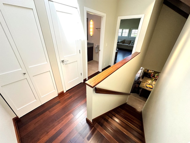 stairs with dark wood-type flooring