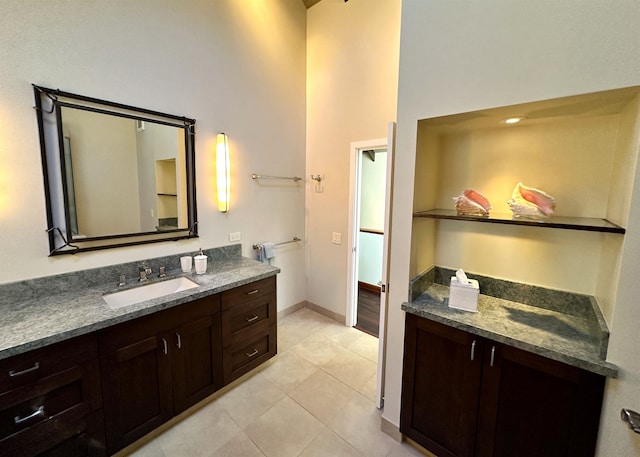 bathroom with tile floors and large vanity