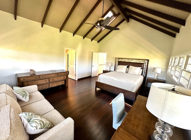 bedroom featuring dark hardwood / wood-style floors, beam ceiling, and high vaulted ceiling