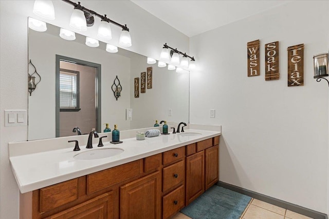 bathroom with tile patterned floors and vanity