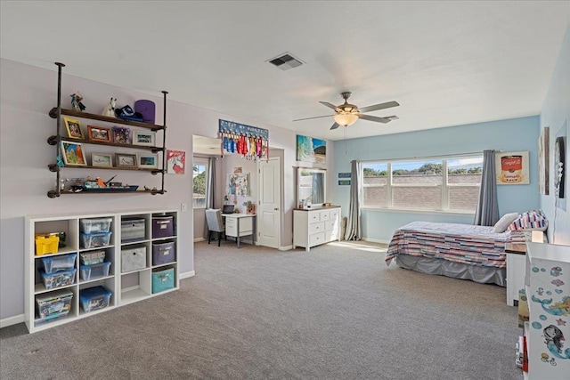 carpeted bedroom featuring ceiling fan