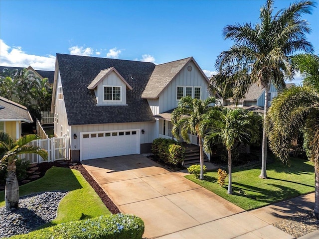 view of front facade with a garage and a front lawn