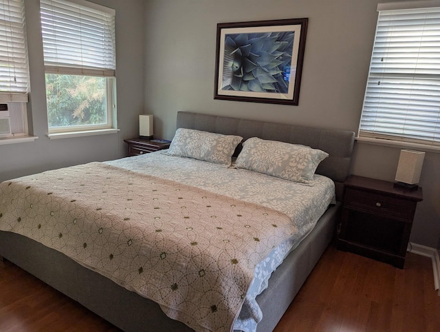 bedroom featuring dark wood-type flooring