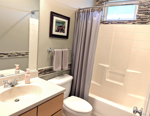 full bathroom featuring shower / bath combination with curtain, vanity, and toilet