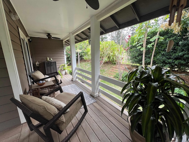 wooden terrace featuring ceiling fan