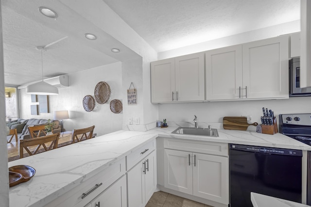 760 S Kihei Rd Unit 419, Kihei, HI 96753 - kitchen featuring appliances with stainless steel finishes, a sink, a textured ceiling, light stone countertops, and open floor plan