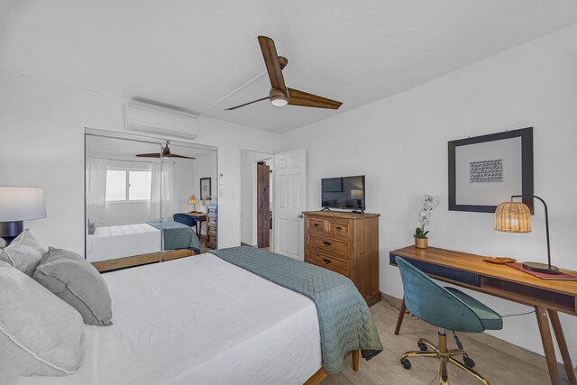 760 S Kihei Rd Unit 419, Kihei, HI 96753 - carpeted bedroom featuring an AC wall unit, ceiling fan, and a desk