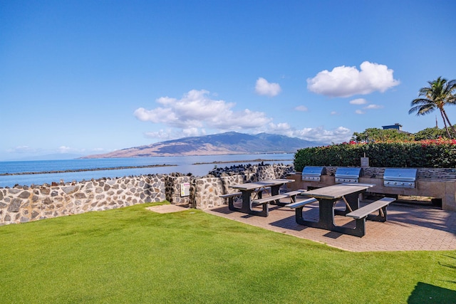 760 S Kihei Rd Unit 419, Kihei, HI 96753 - view of green lawn with a water and mountain view and an outdoor kitchen