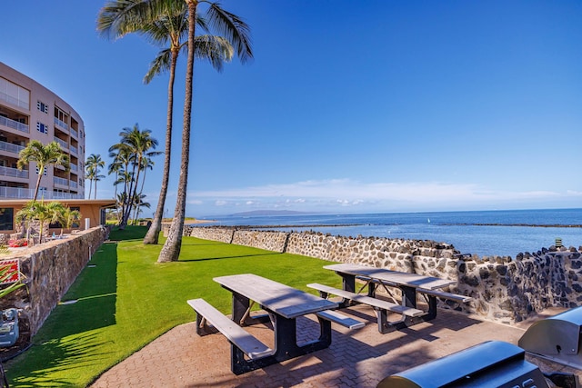760 S Kihei Rd Unit 419, Kihei, HI 96753 - surrounding community featuring a water view, a lawn, and outdoor dining space
